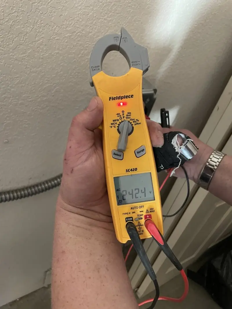 Voltage testing with clamp meter during Circuit Breaker Repair in Spencer